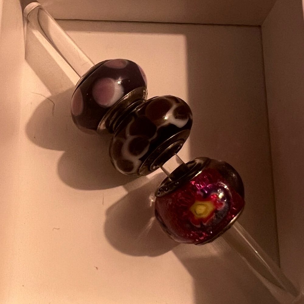 3 purple pandora like beads